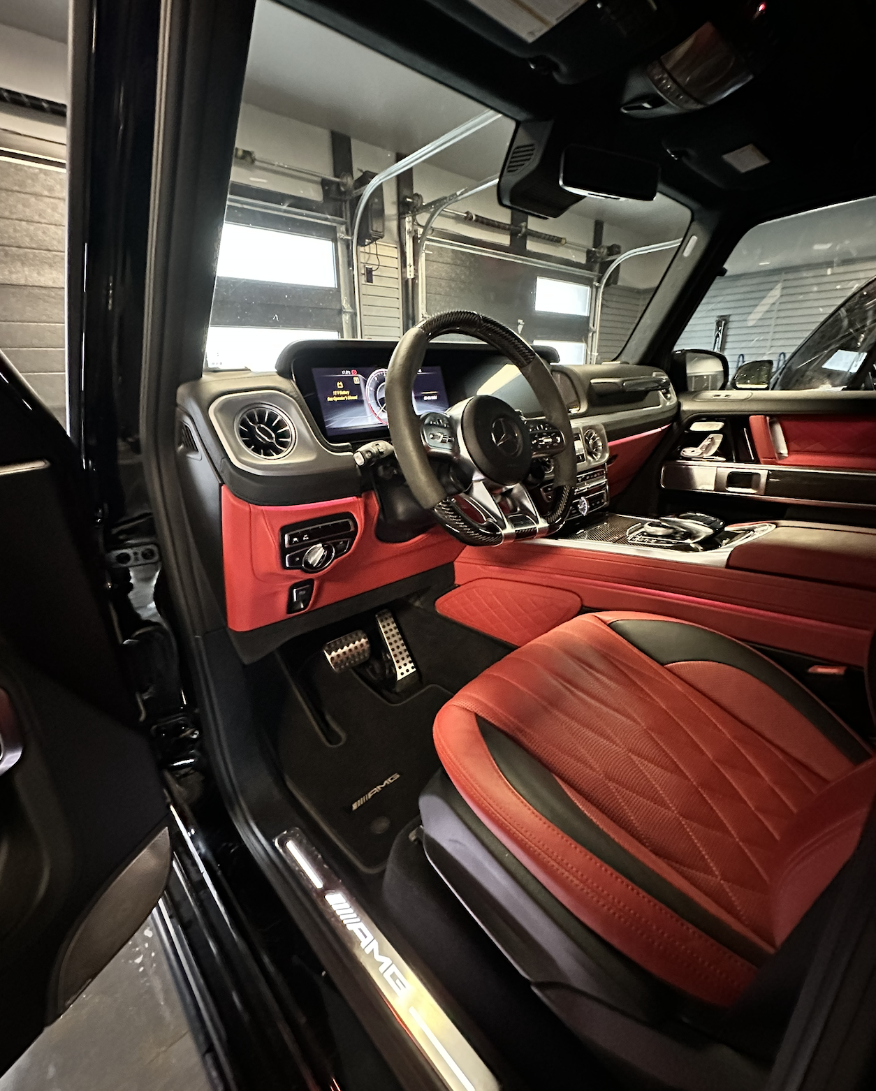 Luxury Mercedes G-Wagon interior detailing with red leather